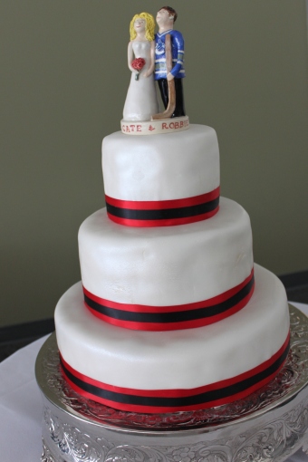 3 tier wedding cake with ribbon